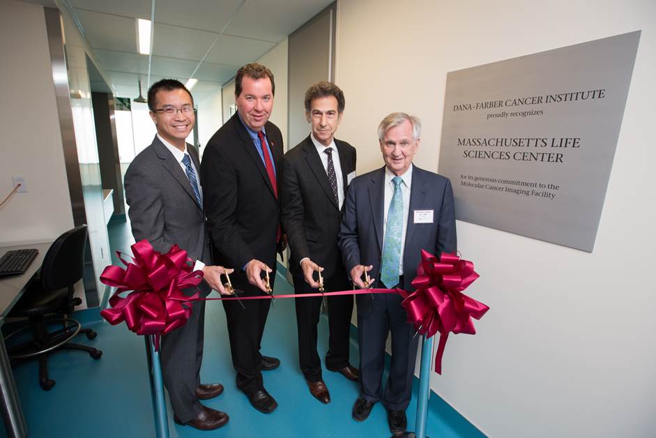 Interim Executive Director and Medical Director of the Boston Public Health Commission Dr. Huy Nguyen, MLSC Vice President for Communications and Marketing Angus McQuilken, Chief Scientific Officer at Dana-Farber Barrett Rollins, MD, Dana-Farber President and CEO Edward J. Benz Jr., MD. participate in a ribbon-cutting ceremony to celebrate the official opening of Dana-Farber’s Molecular Cancer Imaging Facility in Boston’s Innovation District. 